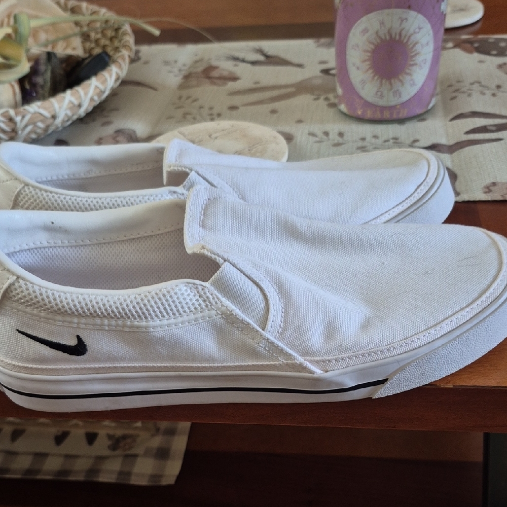 Nike White Canvas Slip-On Sneakers with Black Swoosh Accent